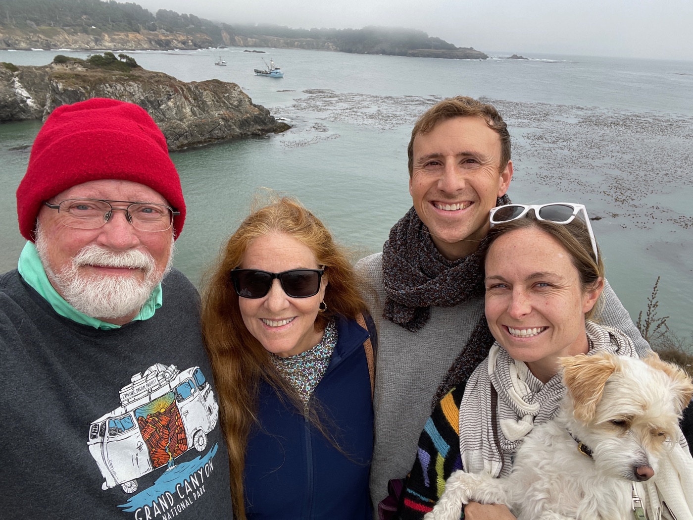 Terry, Clif, Chris, and Lucy along the California coast, with their dog.